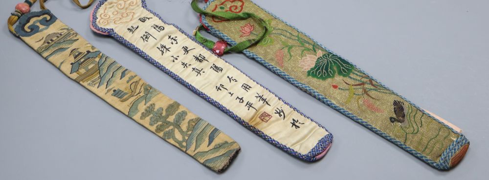 Three embroidered Chinese fan cases, one Kesi and woven with a tree, river and temple motifs, another with fine embroidered duck and li